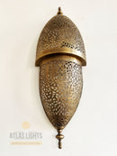 Decorative brass wall light fixture with intricate patterns on a white background, branded 'Atlas Lights'.