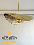 Decorative ceiling light fixture with 'Atlas Lights' branding on a neutral background
