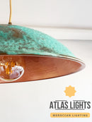 Turquoise and copper pendant light with 'Atlas Lights' branding on a white background