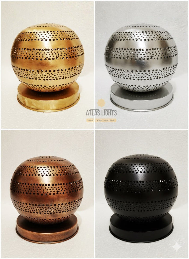 Moroccan spherical metal lamps in gold, silver, bronze, and black on a white background.