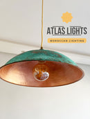 Moroccan-style oxidized pendant light with 'Atlas Lights' branding on a white background