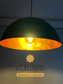 Pendant light with gold interior and black exterior, branded 'Atlas Lights'.