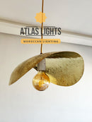 Moroccan-style pendant light with 'Atlas Lights' branding on a neutral background