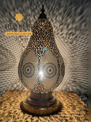 Decorative Moroccan-style table lamp with intricate patterns, branded 'Atlas Lights'.