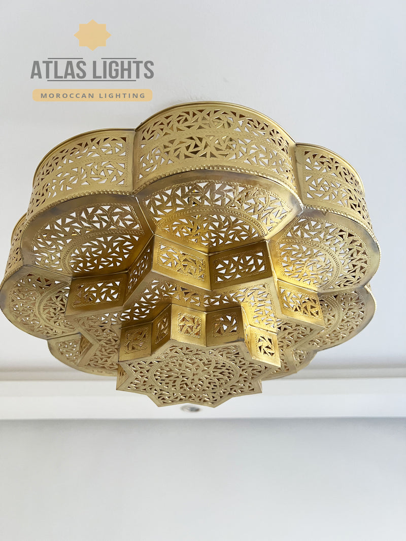 Handmade Moroccan brass ceiling lamp with geometric design. Adds luxury and warmth to your home. Available in gold, bronze, silver & black.