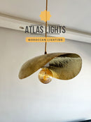 Moroccan-style pendant light with 'Atlas Lights' branding on a neutral background