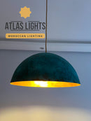 Teal pendant light with gold interior on a plain background, featuring 'Atlas Lights' branding.
